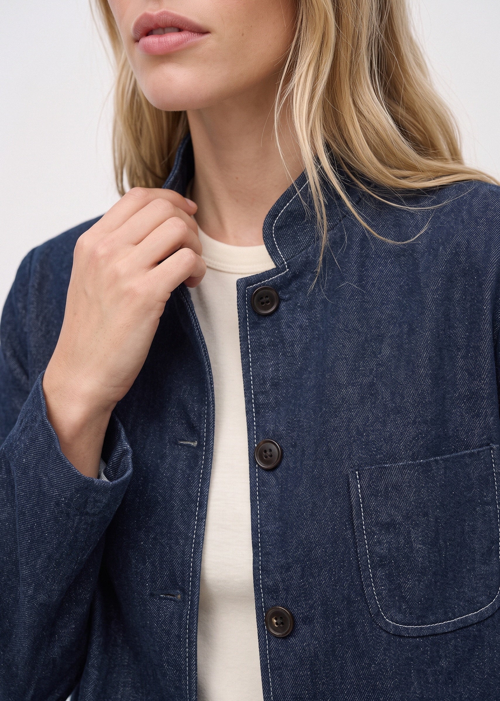 Denim jacket stand collar, buttons and chest pocket detail