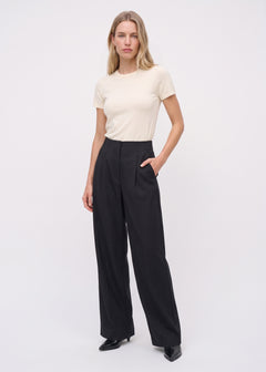 Black relaxed-leg pants, full front view