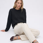 White corduroy pants, seated view
