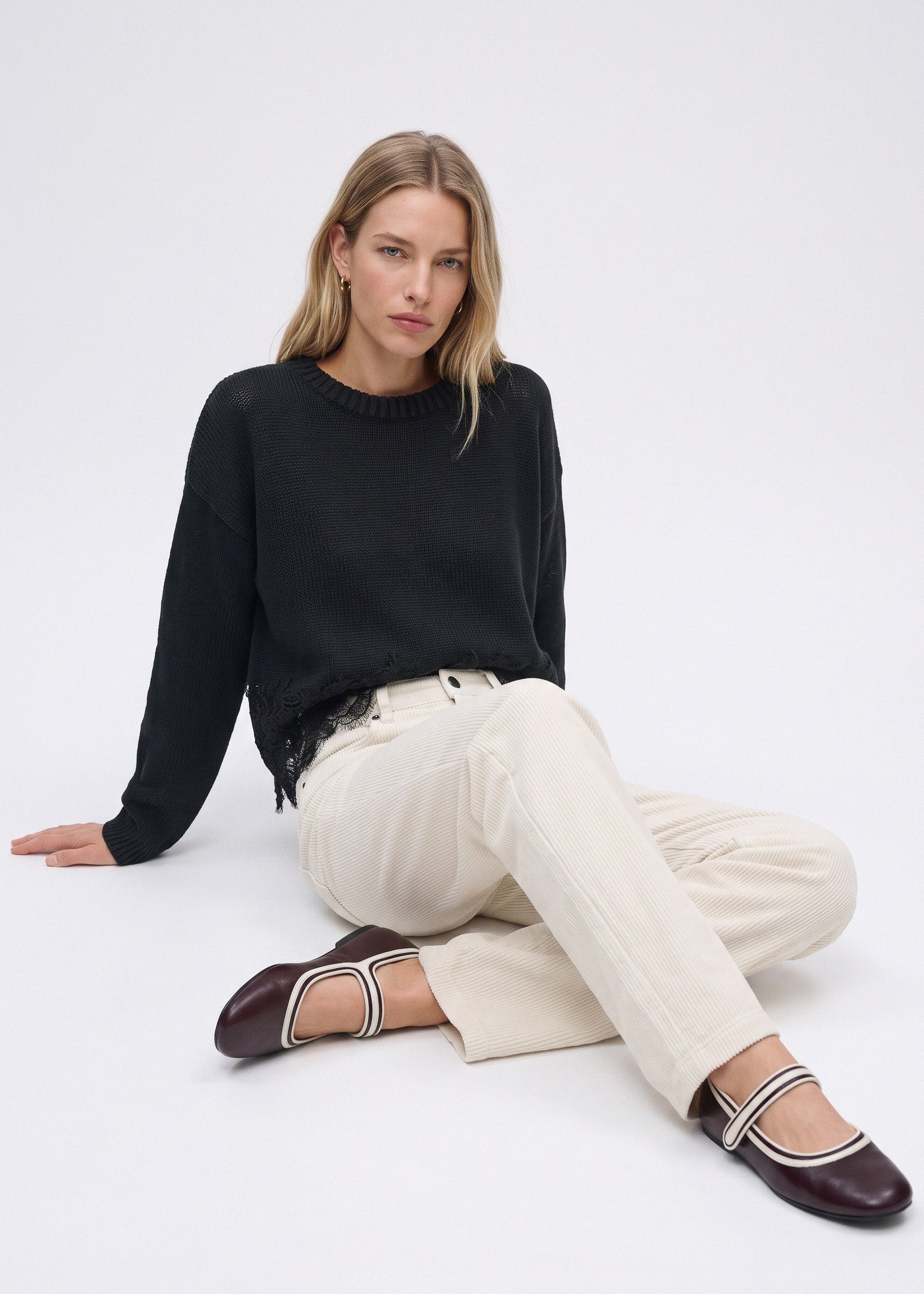 White corduroy pants, seated view