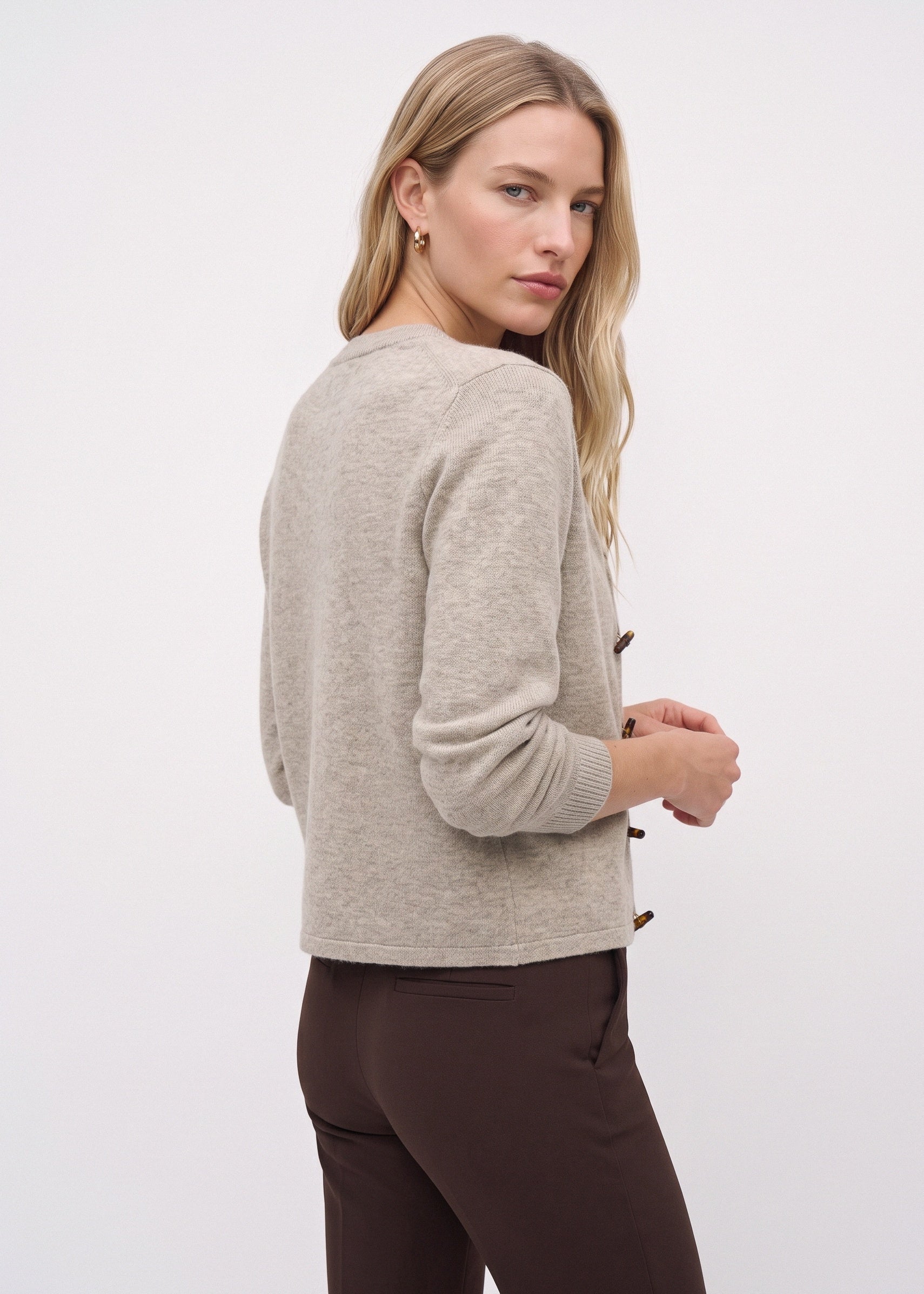 Beige merino cardigan, back three-quarter view