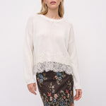 White linen sweater with floral lace hem, front view