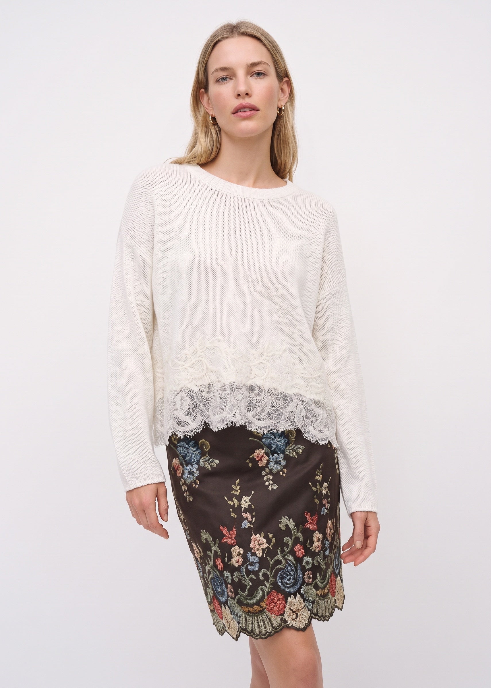 White linen sweater with floral lace hem, front view