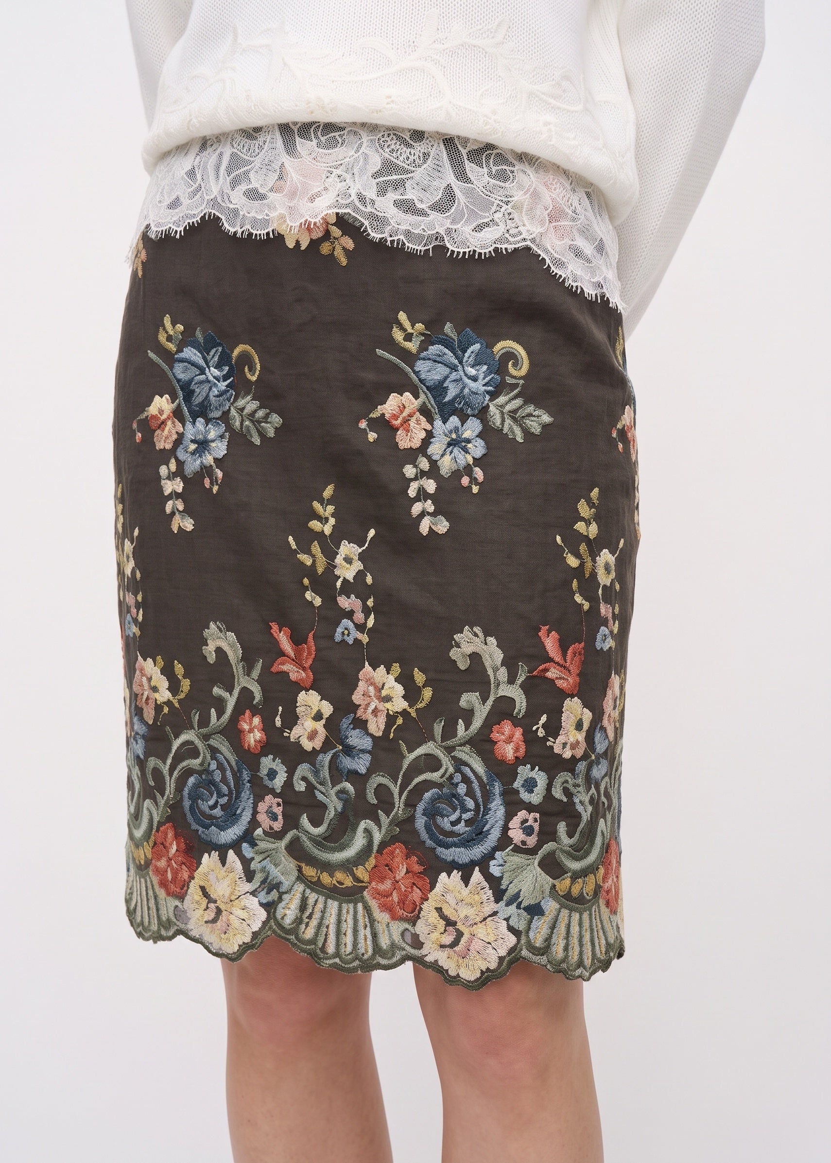 Blue and pink floral embroidery and scalloped skirt hem detail